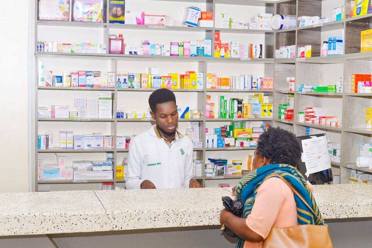 Pharmacist assisting a patient at Entebbe Medical Chambers
